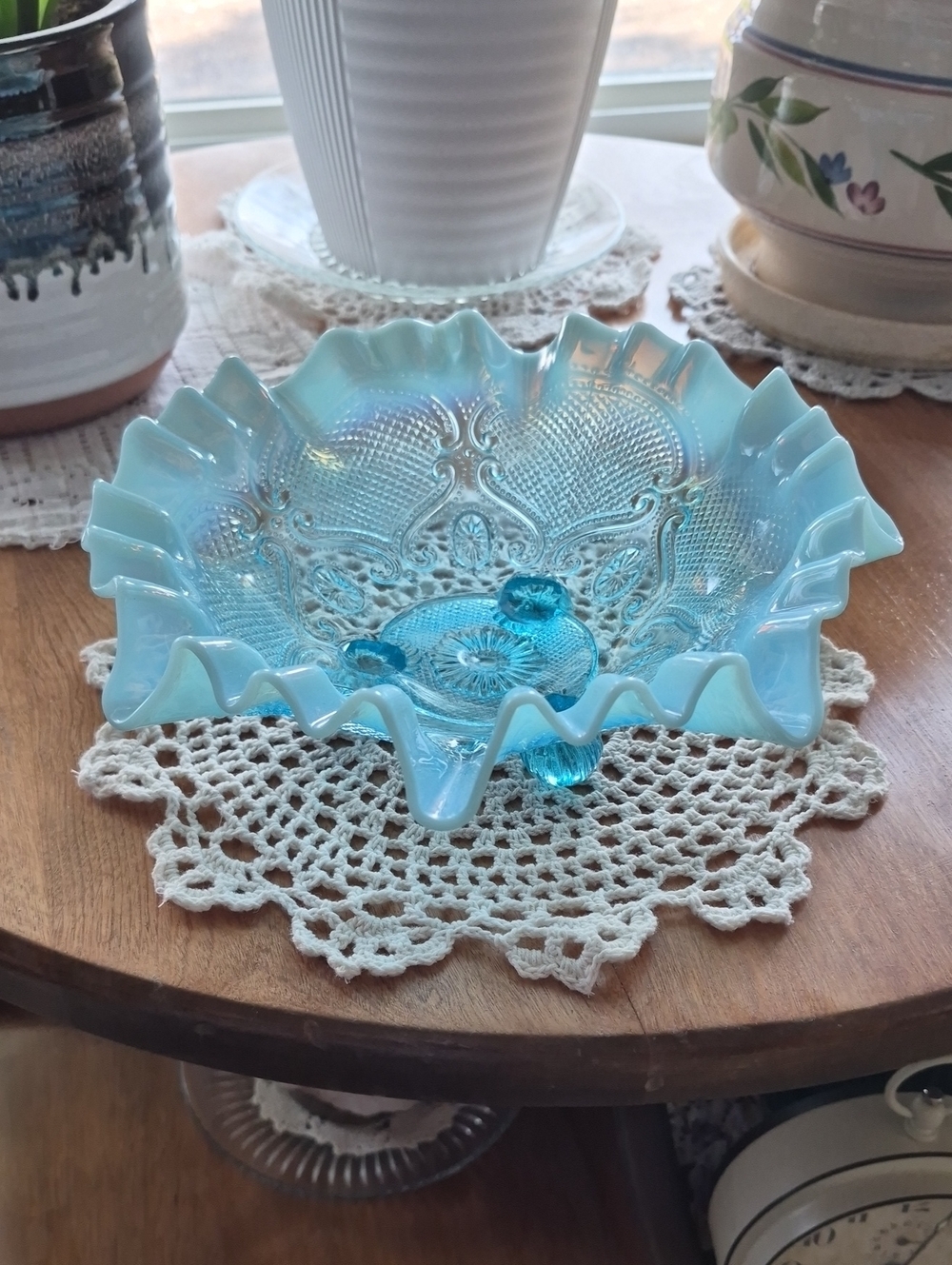 Northwood Glass ruffled bowl featuring a blue opalescent finish